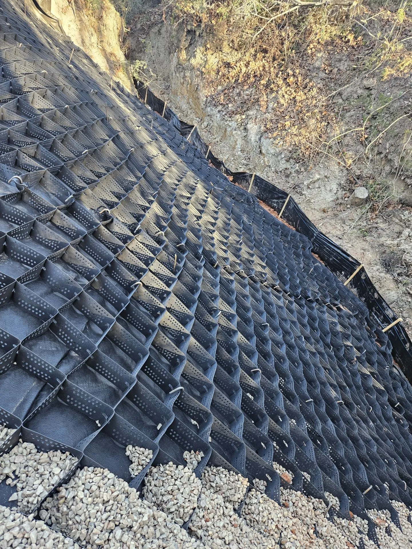 Grading the hillside for paver installation